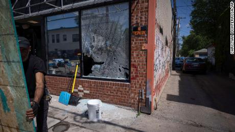 A broken window is boarded up after shots were reportedly fired in George Floyd Square on the anniversary of Floyd&#39;s death on Tuesday. 