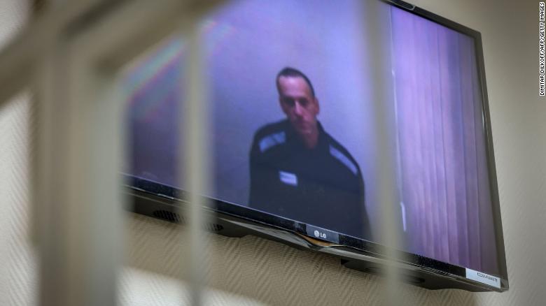 Jailed Kremlin critic Alexey Navalny appears on screen via a video link from prison during a court hearing in the town of Petushki some 75 miles outside Moscow in May.