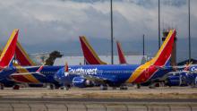 VICTORVILLE, CA - MARCH 24: Southwest Airlines jets are parked in growing numbers at Southern California Logistics Airport (SCLA) on March 24, 2020 in Victorville, California. As the coronavirus pandemic grows, exponentially increasing travel restrictions and the numbers of people in quarantine, airlines around the world are scrambling to find places to park a majority of their fleet as they wait to see how the situation will play out. (Photo by David McNew/Getty Images)