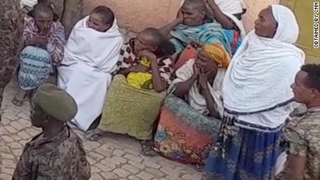A screenshot from video obtained by CNN shows Ethiopian soldiers addressing families inside the UNHCR compound awaiting word of their loved ones.
 