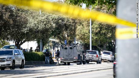 Emergency responders gather at the scene of the shooting.