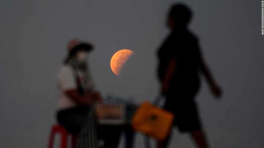 The moon is seen near the Indonesian island of Bali during Wednesday&#39;s total lunar eclipse.