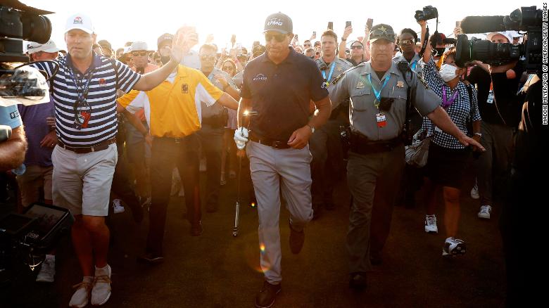 Mickelson walks the 18th fairway before winning the 2021 PGA Championship.