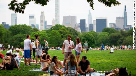 People gather in Central Park in New York on May 22, 2021. - After 16 months of restrictions in place due to the novel coronavirus pandemic, New Yorkers can now enjoy a city where most restrictions have been lifted. But true to their caution since the beginning of the pandemic, many are still reluctant to party and go back to their pre-pandemic social lives. (Photo by Kena Betancur / AFP) (Photo by KENA BETANCUR/AFP via Getty Images)