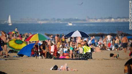People fill Brighton Beach in New York&#39;s Coney Island in July 2020.