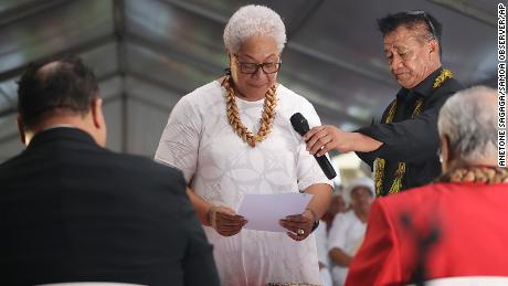 Samoa&#39;s Prime Minister-elect Fiame Naomi Mata&#39;afa takes her oath at an unofficial ceremony outside parliament house in Apia, Samoa, on May 24, 2021. 