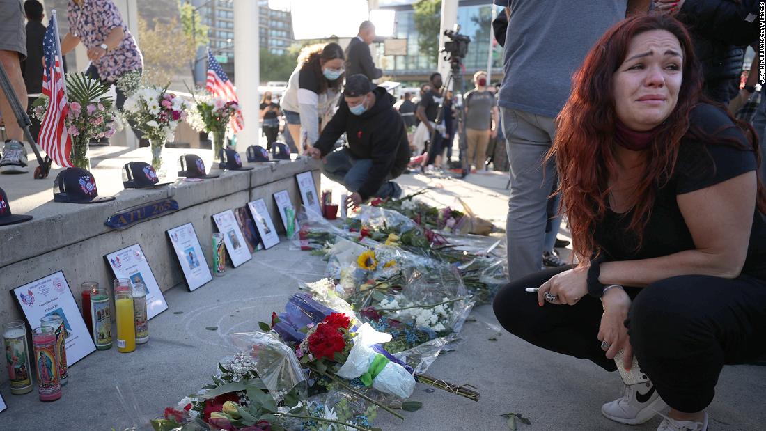 Mourners gather at San Jose City Hall to show their community is not broken after a shooting killed 9 people