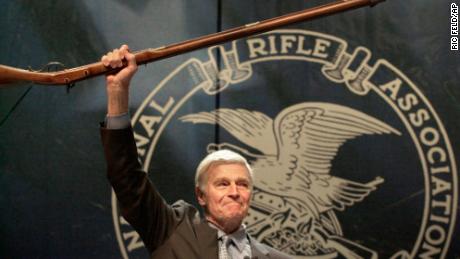 NRA president Charlton Heston holds up a musket at the group&#39;s 129th annual conference in May 2000 in Charlotte, North Carolina.
