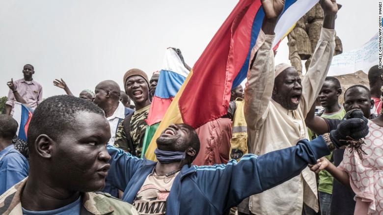 Russian and Malian flags are waved by protesters in Bamako, during a demonstration against French influence in the country on May 27.