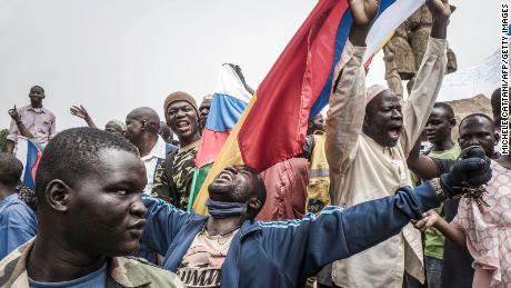 Russian and Malian flags are waved by protesters in Bamako, during a demonstration against French influence in the country on May 27.