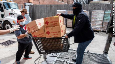 American Red Cross volunteers help move comfort kits in Houston, Texas, on Sunday February 21, 2021.