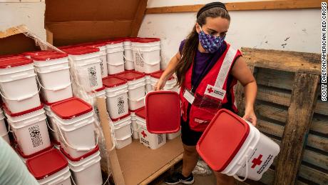 American Red Cross volunteer Casey Garnett unloads emergency cleaning kits after Hurricane Laura, in Georgetown, Louisiana, on Friday, September 4, 2020.