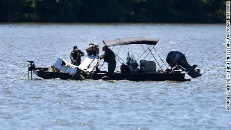 Emergency personnel remove debris of a plane crash from Percy Priest Lake in Smyrna, Tennessee, on Sunday. 