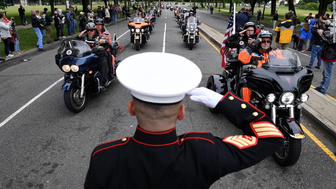 Veteran Tim Chambers salutes motorcyclists participating in the &quot;Rolling to Remember&quot; event in Washington, DC, on Sunday, May 30.