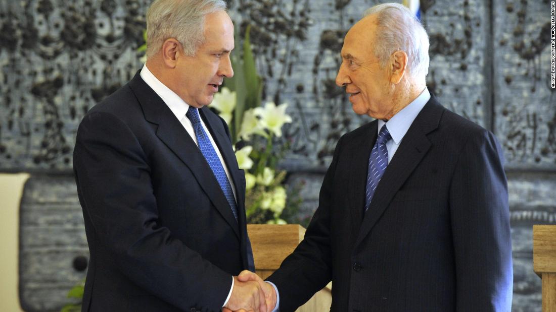 Netanyahu shakes hands with Israeli President Shimon Peres in February 2009 after winning backing from the Israeli parliament to become prime minister again. A close election between Netanyahu and rival Tzipi Livni had left the results unclear until the parliament&#39;s decision.