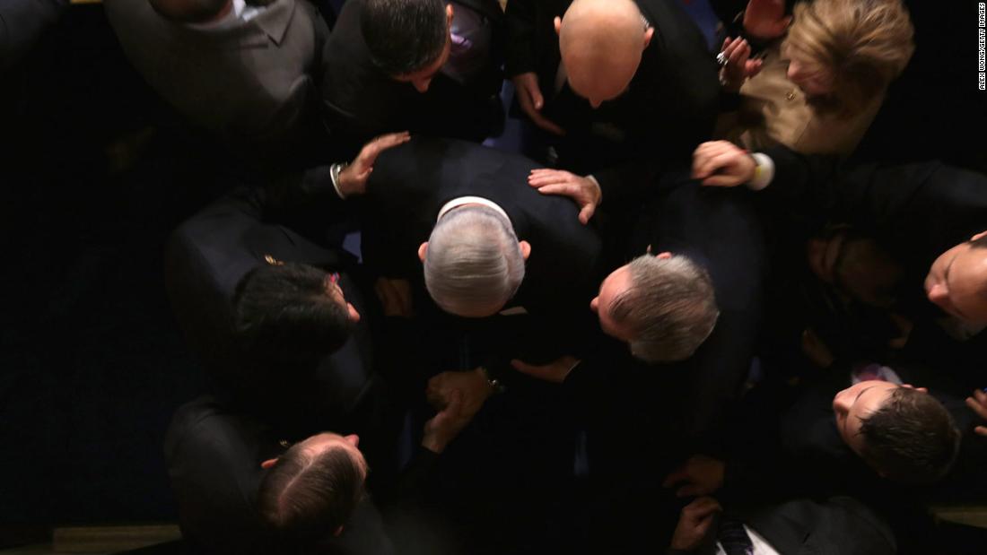 Netanyahu is greeted by members of US Congress as he arrives to speak in the House chamber in March 2015. He warned that a proposed agreement between world powers and Iran was &quot;a bad deal&quot; that would not stop Tehran from getting nuclear weapons.