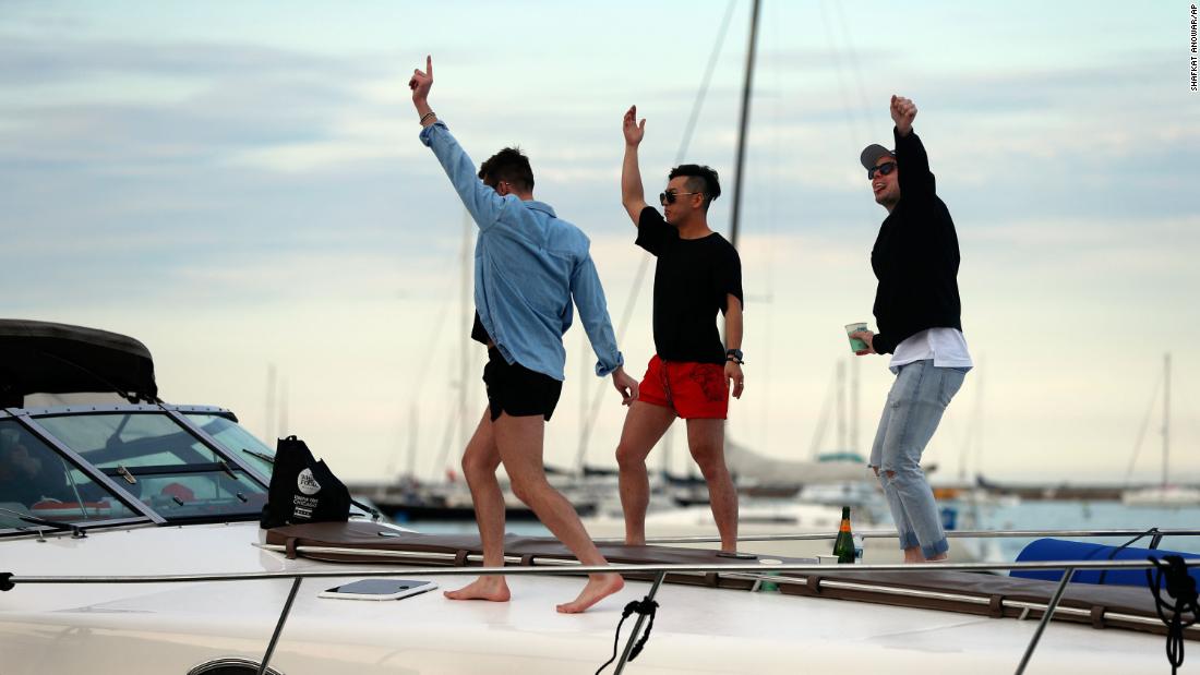 People dance on a boat in Chicago on Sunday.