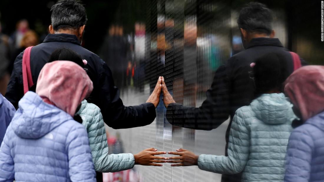 People visit the Vietnam Veterans Memorial in Washington, DC, on Sunday.