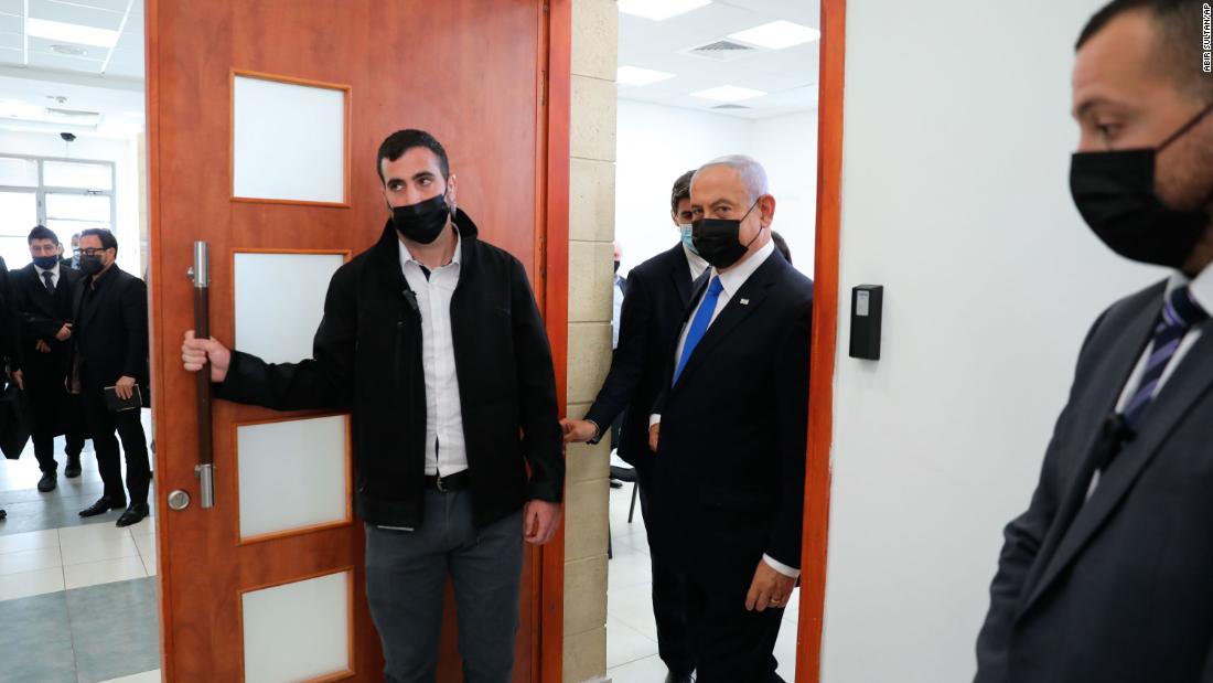 Netanyahu comes out of a Jerusalem courtroom during the evidence-hearing stage of his corruption trial in April 2021. Netanyahu faces charges in three separate cases. He has denied the charges, describing them as a media-fueled witch hunt against him.