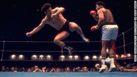 Inoki in action against Muhammad Ali during an exhibition match.
