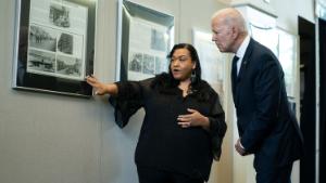 Michelle Brown-Burdex, program coordinator of the Greenwood Cultural Center, speaks as she leads President Joe Biden on a tour of the Greenwood Cultural Center to mark the 100th anniversary of the Tulsa race massacre, Tuesday, June 1, 2021, in Tulsa. (AP Photo/Evan Vucci)