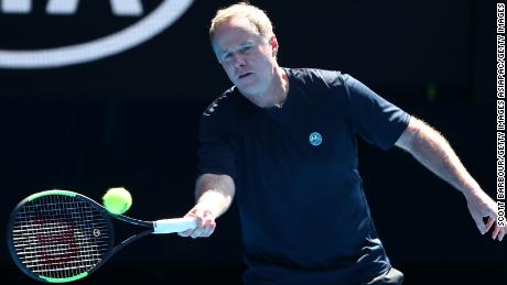 MELBOURNE, AUSTRALIA - JANUARY 21: Patrick McEnroe of the United States plays a forehand in his Men's Legends match with and John McEnroe of the United States against Henri Leconte of France and Todd Woodbridge of Australia during day eight of the 2019 Australian Open at Melbourne Park on January 21, 2019 in Melbourne, Australia. (Photo by Scott Barbour/Getty Images)