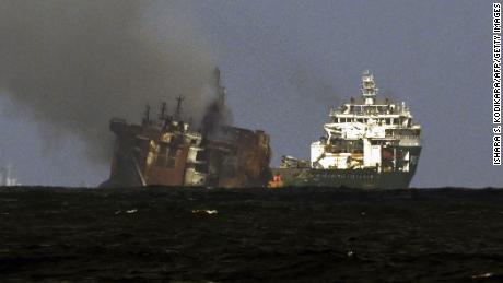 A tugboat from the Dutch salvage firm SMIT tows the fire stricken Singapore-registered container ship MV X-Press Pearl away from the coast of Colombo on June 2.