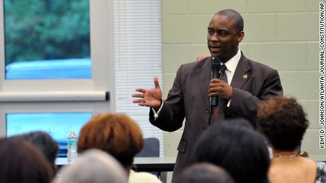 In this photo from Aug. 16, 2012, Sheriff Victor Hill speaks at a candidate forum in Rex, Georgia.