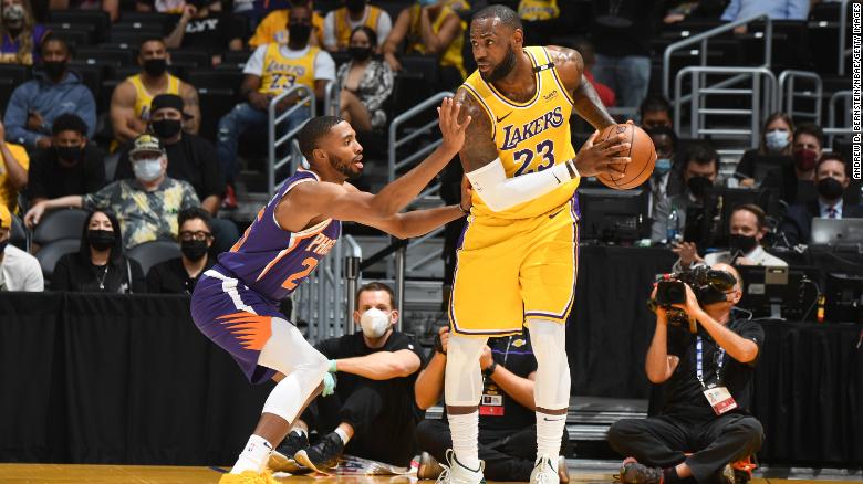 Mikal Bridges (left) of the Suns defends LeBron James of the Lakers on June 3, 2021 in Los Angeles