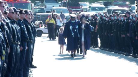 Firefighters line the entrance to Thursday&#39;s graduation ceremony as Joslyn Carlon and her family walked in.