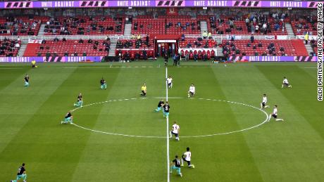 Players and officials take a knee ahead of the international friendly match between England and Austria at the Riverside Stadium on June 02, 2021 in Middlesbrough.
