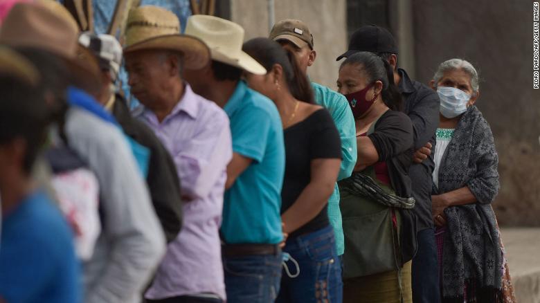 People queue to cast their vote at a polling station in Atzacoalco, Guerrero state, Mexico, on June 6, 2021.