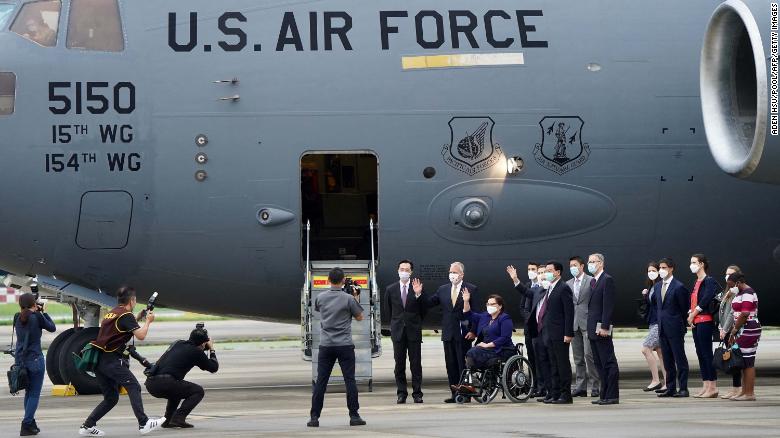 US senators are seen in front of the US Air Force C-17 Globemaster III freighter upon their arrival at Taipei's Songshan Airport on June 6.