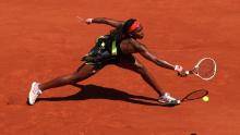 Gauff plays a backhand in her ladies singles fourth round match against Ons Jabeur.