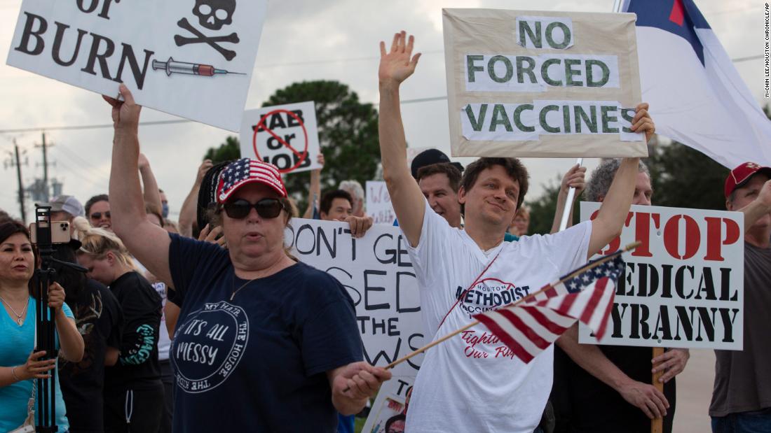 Employees protest against Houston hospital's policy that all staff must be vaccinated against Covid-19