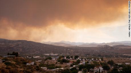 Smoke from the Telegraph Fire hangs over the towns of Globe and Miami, Arizona, on Monday, June 7.
