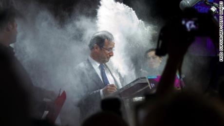 Hollande, floured by a woman on February 1, 2012 in Paris.