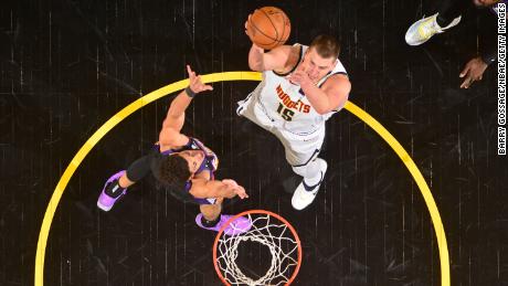 Jokic shoots the ball against the Phoenix Suns.