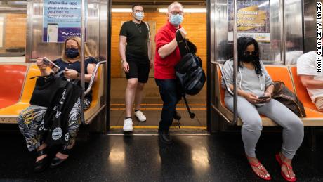 People ride the subway in New York City on May 26. 