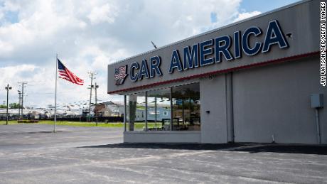 A car dealership stands empty in Laurel, Maryland.