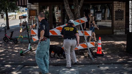 An ATF K9 unit surveys the area near the scene of the shooting