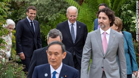 US President Joe Biden (C) and G7 leaders arrive for a group photo during a reception in Cornwall, England, on June 11, 2021. The climate crisis was a key issue during the meeting. 