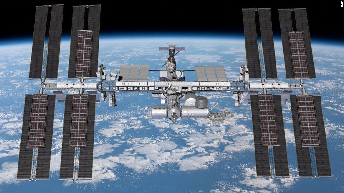 Astronauts begin spacewalk to install solar panels on International Space Station