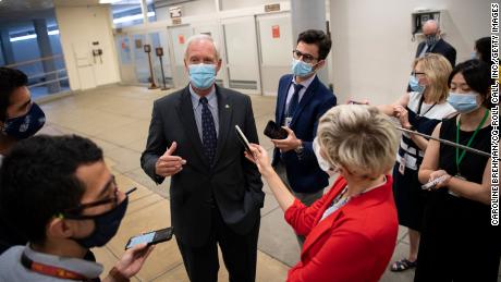 Sen. Ron Johnson of Wisconsin talks to reporters on his way to a vote in the Capitol on July 22, 2020.