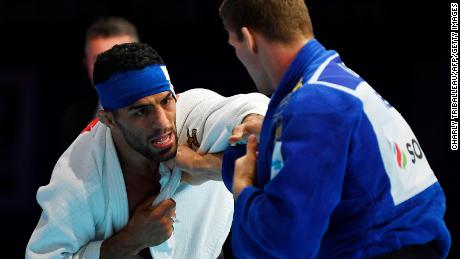 Iran&#39;s Saeid Mollaei (in white) fights against Belgium&#39;s Matthias Casse during the semifinal of the men&#39;s under 81kg category during the 2019 Judo World Championships at the Nippon Budokan, a venue for the upcoming Tokyo 2020 Olympic Games. Mollaei, who claimed he was ordered to deliberately lose a world championship fight, could compete under a refugee flag at the 2020 Tokyo Olympics, officials said on September 1.  