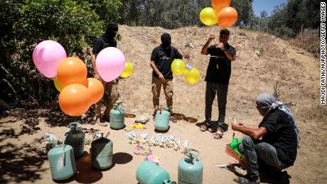 Militants east of Gaza City are preparing incendiary balloons on Wednesday to launch themselves across the border fence into Israel.