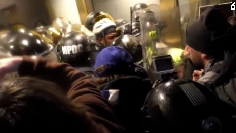 New Capitol riot videos show mob battling officers in tunnel