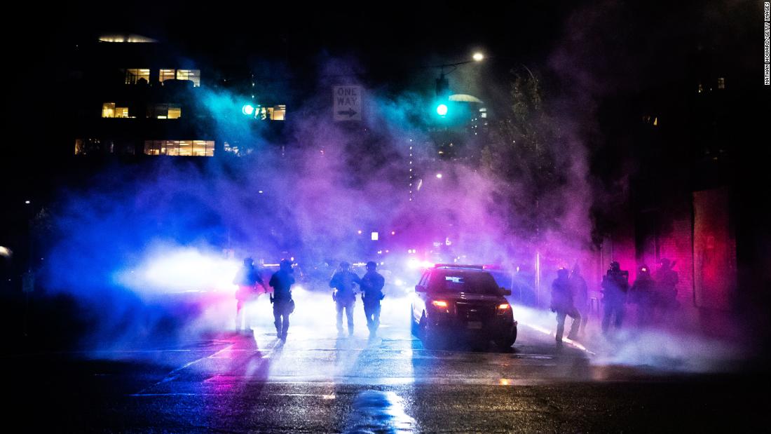 As gun violence soars along with scrutiny on police actions, some officers — like an entire team in Portland — are pulling back