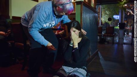 Roem falls to her knees after getting a call from Joe Biden congratulating her for her 2017 victory at an election watch party in Gainesville, Virginia. 