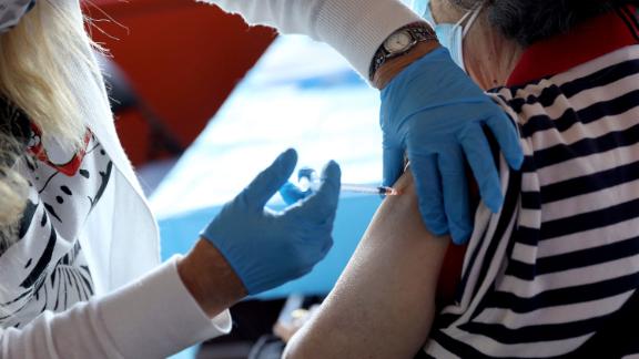 A healthcare worker administers the vaccine as the Empire State Building Offers COVID-19 Vaccines at its Observatory on June 18, 2021 in New York City. 